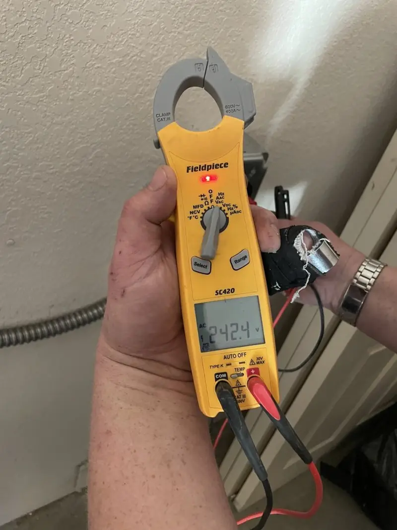 Voltage testing with clamp meter during Outlet Installation in Lytle